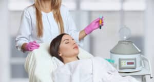 Provider processing a patient's blood during PRP treatment for facial rejuvenation
